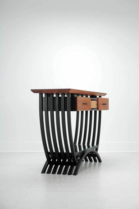 Side view of a curvy console table finished with Rubio Monocoat hardwax oil wood finish.