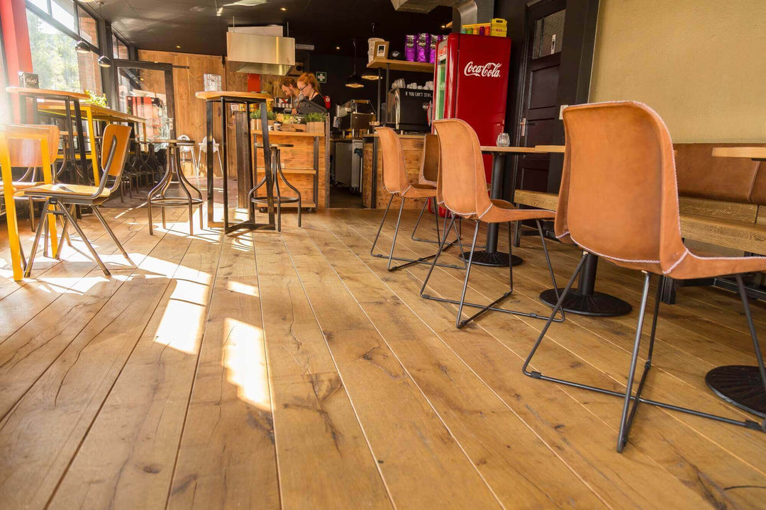 Aged oak hardwood flooring in a lounge.