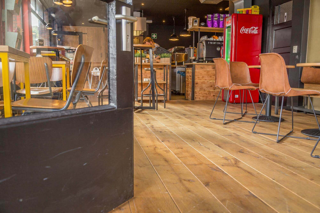 A store with aged oak wood flooring.