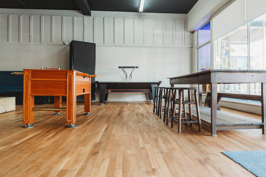 Coffee house that has freshly refinished hardwood flooring.