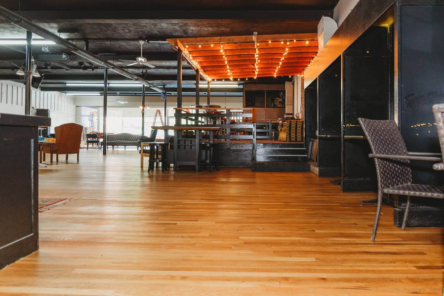 Sand and refinished hardwood flooring in a coffee shop.