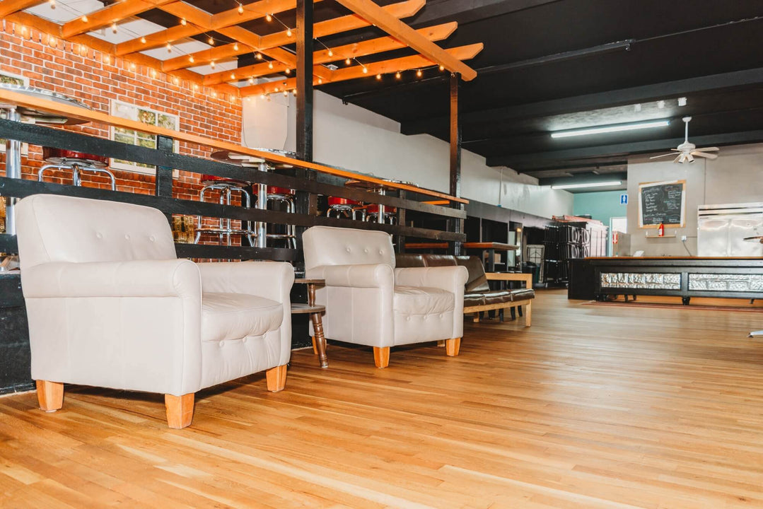 Coffee shop with matte hardwood flooring.