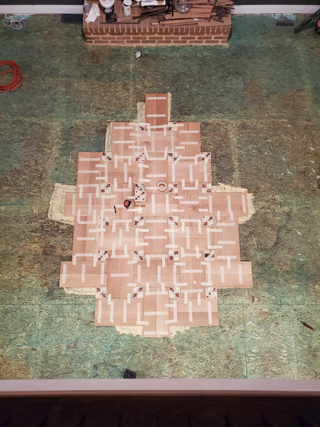 The beginning of laying a basketweave hardwood patterned wood floor. 