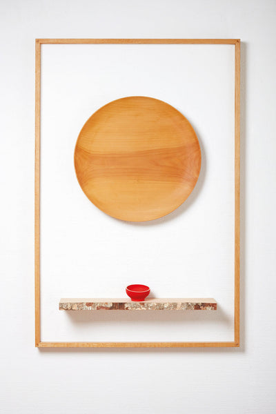 Wooden art hangs on exhibit wall and is finished with Rubio Monocoat wood finish.