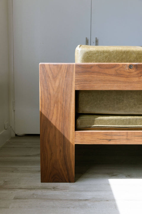 View from the back of a sofa made from solid walnut wood.