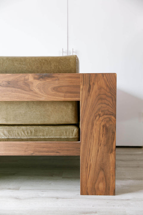 Alternate view from the back of a sofa made of walnut wood.