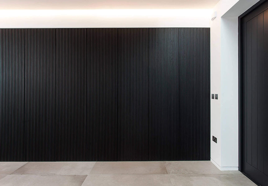 A straight on look of of the black slatted wood wall made from white oak.