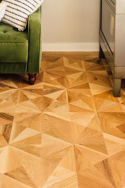 NWFA Wood Floor of the Year finalist features solid oak parquet with brass border inlay.