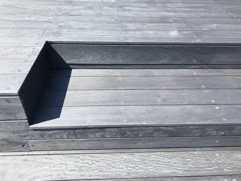 Ipe steps with dark colored decking on on them.