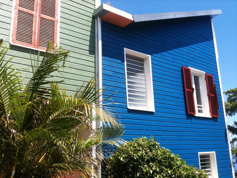 Color blue and green siding on condos.