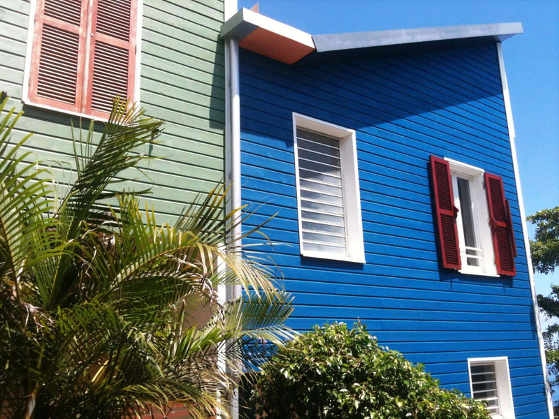 Color blue and green siding on condos.