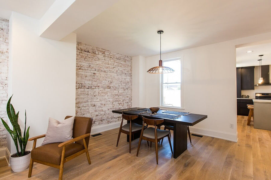 Dining area with white oak flooring.
