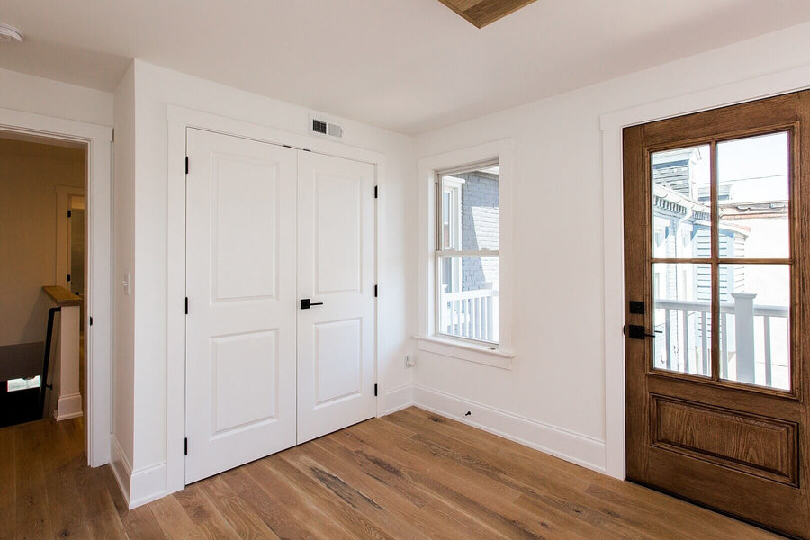 Entryway in a house with white oak flooring finished with matte floor finish.