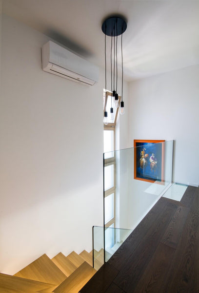 Dark hardwood flooring on the upstairs of a home.