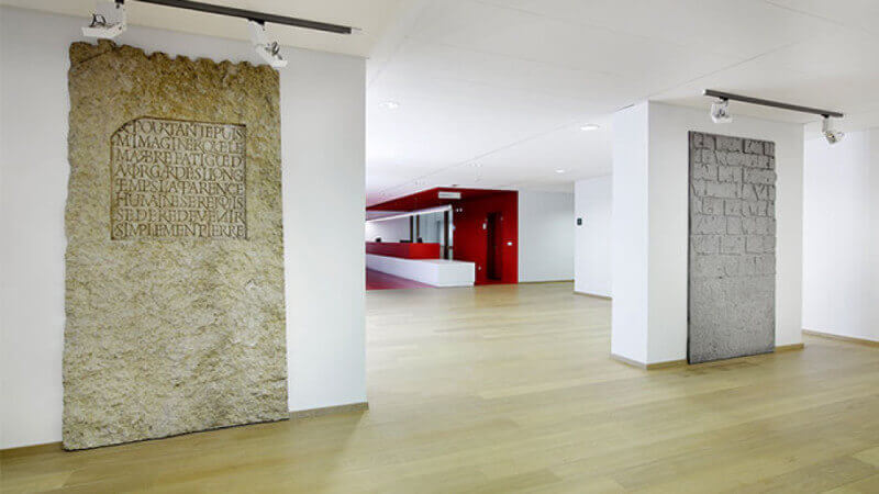 College with artwork on display and hardwood flooring