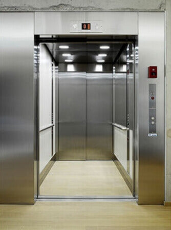 French Oak flooring on an elevator floor inside of a school