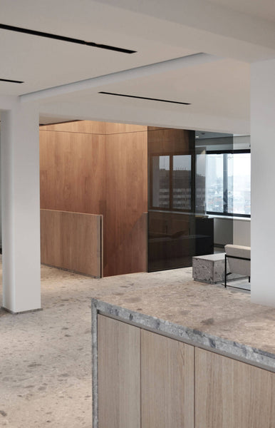 Interior designed office space with wood and stone elements.