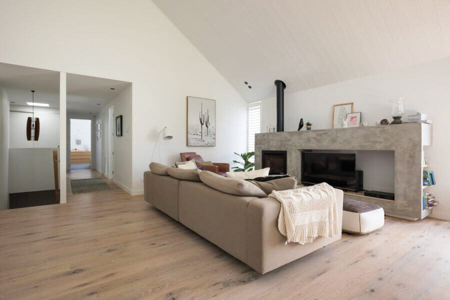 Living room with wide oak plank flooring.