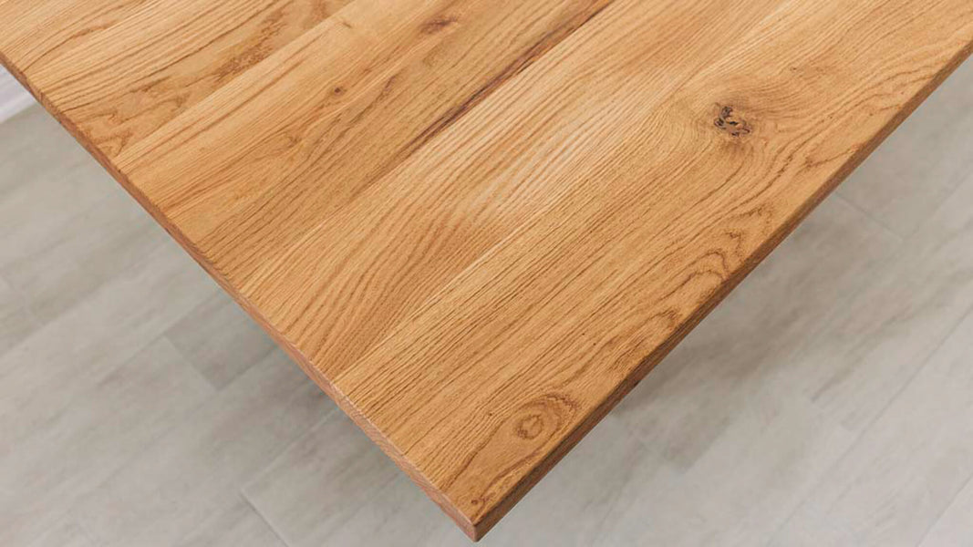 Close up of the grain of a white oak table finished with Rubio Monocoat Oil Plus 2C "Pure".