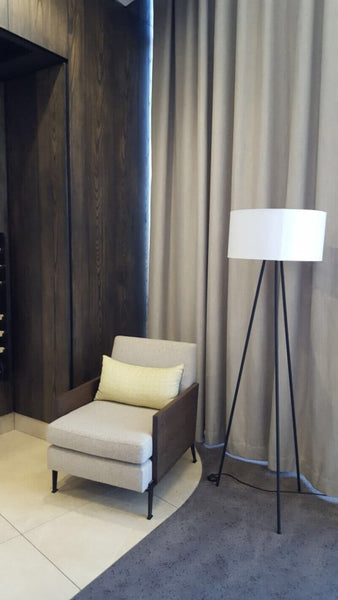 Lamp in high rise building with wood wall cladding.