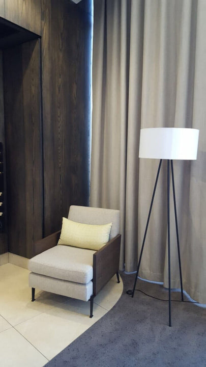 Lamp in high rise building with wood wall cladding.