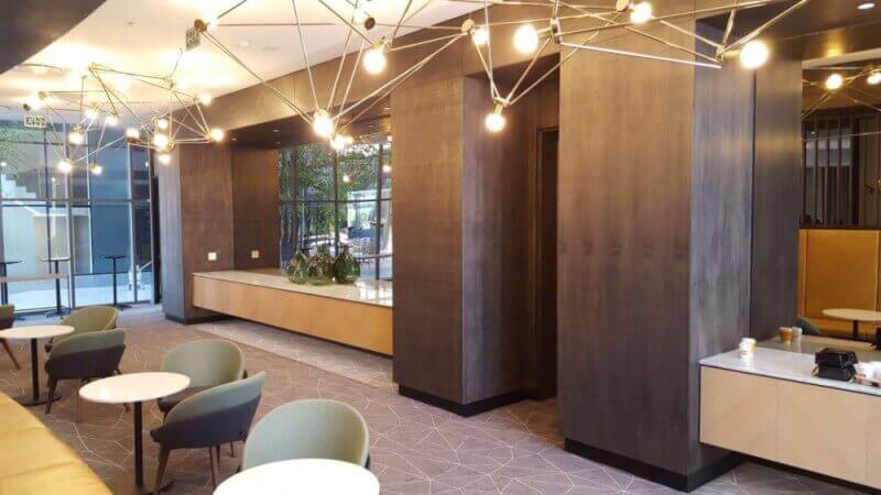 Wall cladding and cabinetry made out of wood in an office building.