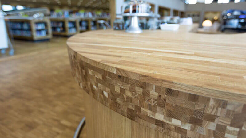 Unique details of a wooden counter at a library finished with Oil Plus 2C.