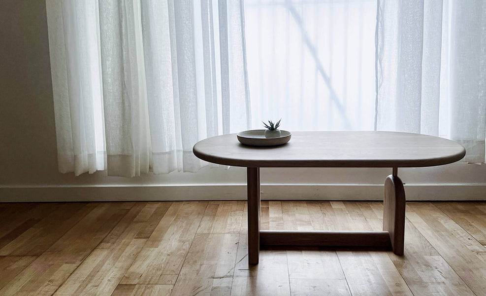 A backlit shot of the inverse coffee table, highlighting the clean lines of the modern design.