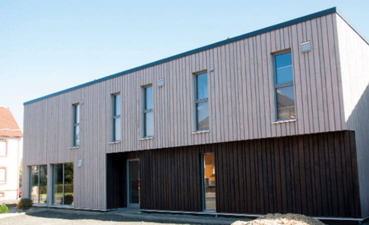 Exterior wood finish on wood paneled building.