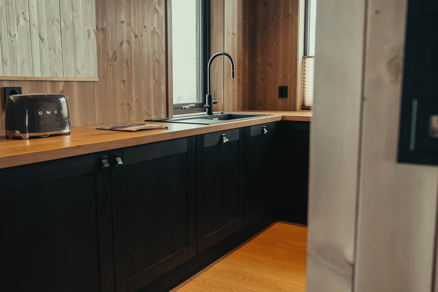 Starke black kitchen cabinets made from oak and finished with hardwax oil.