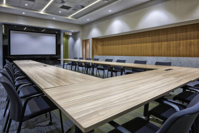 Conference room with massive wooden table finished with Rubio Monocoat.