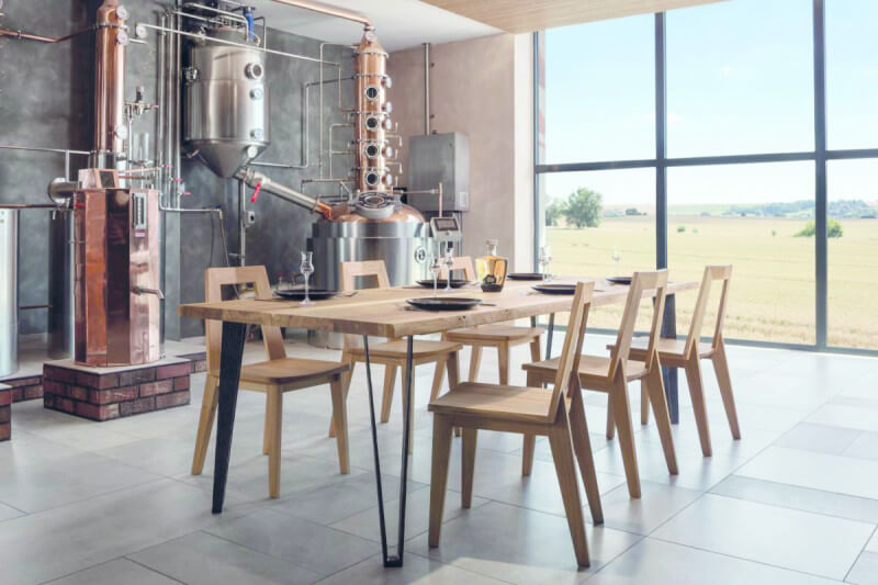 Wide view of unique oak dining table finished with Rubio Monocoat Oil Plus 2C.