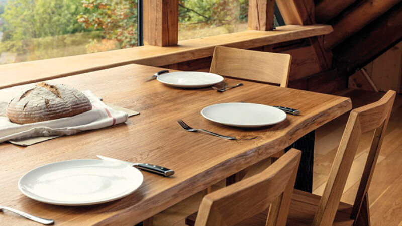 Wooden live edge dining table finished with Rubio Monocoat.