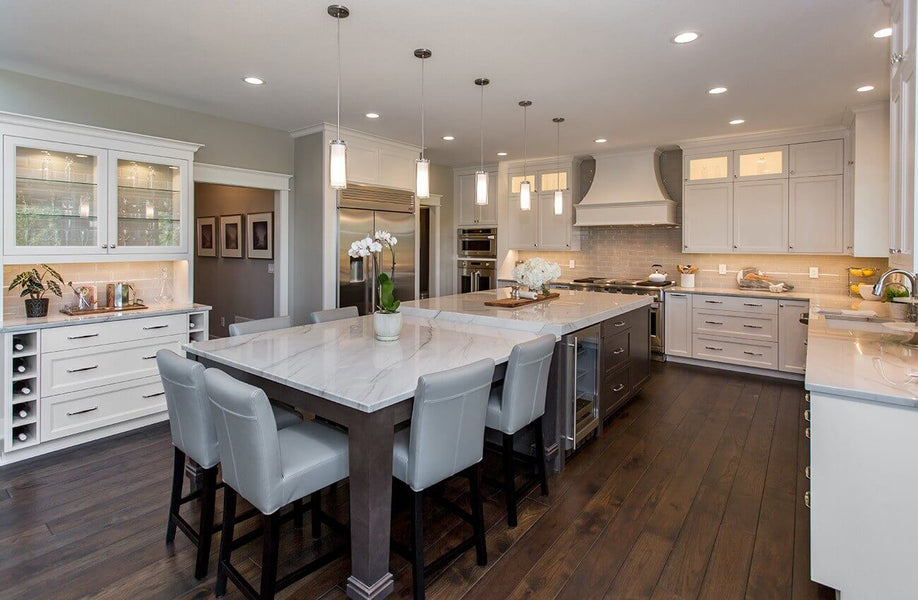 Kitchen design with dark hardwood flooring and light cabinetry.
