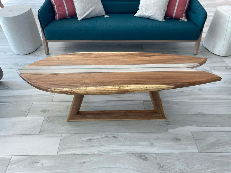 Wood coffee table modeled after a surfboard.