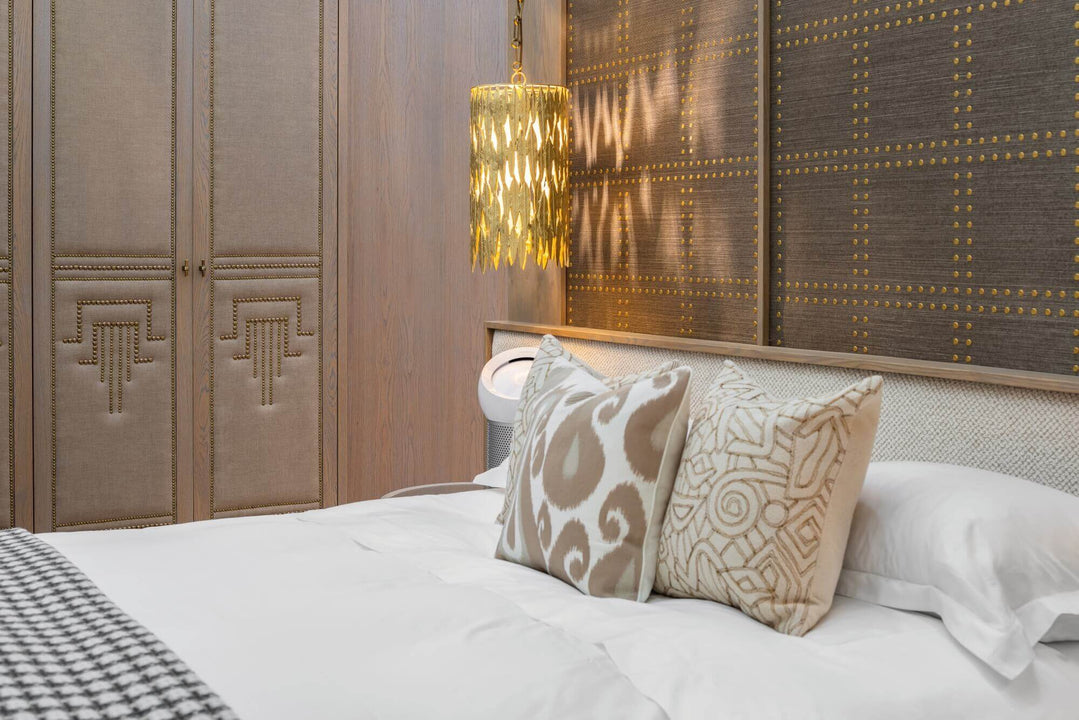Luxurious bedroom with wood paneling on the walls.