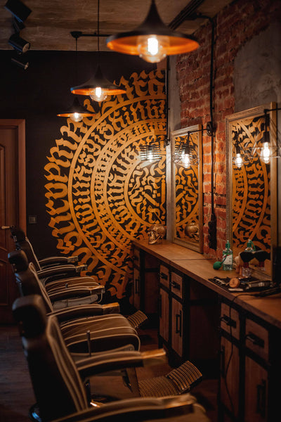 The interior of a warm and cozy barbershop with industrial design.
