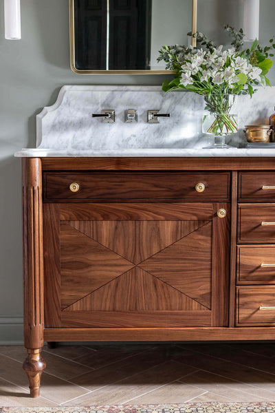 Close up of Jen Woodhouse's black walnut bathroom vanity inspired by Louis XVI furniture.