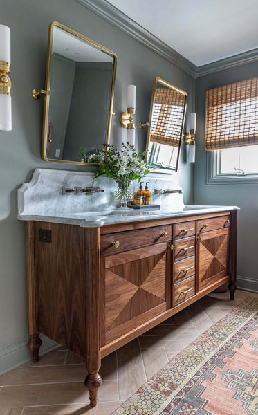 Side view of Jen Woodhouse's black walnut bathroom vanity, complete with an electrical outlet.