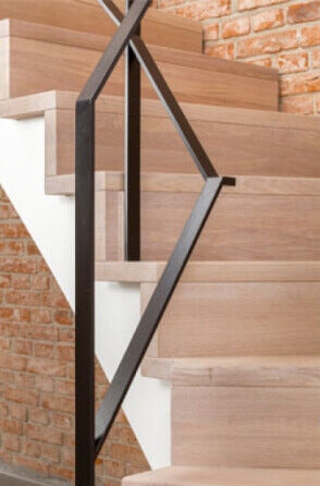 A detail shot of oak stair treads finished with a natural wood oil finish.