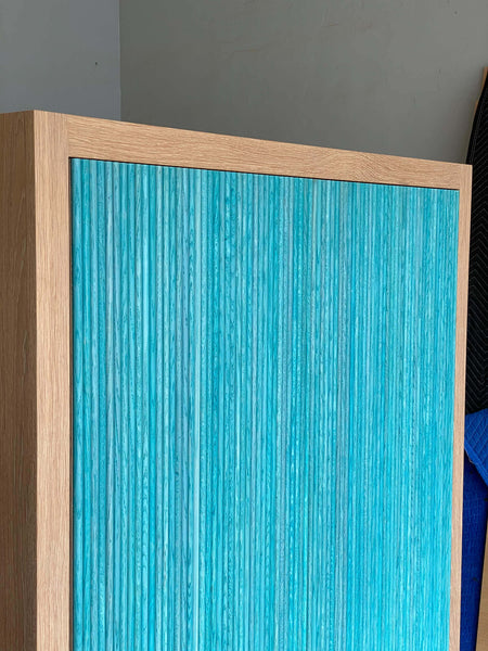 Unique texture to wooden entry cabinet.