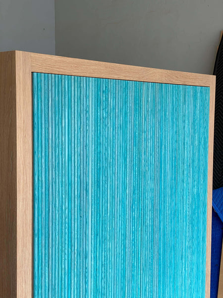 Unique texture to wooden entry cabinet.