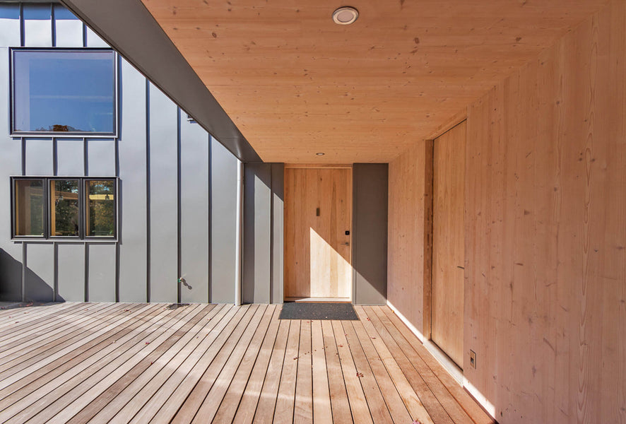 The front entrance of the Berghaus Hunter contemporary lodge style home.