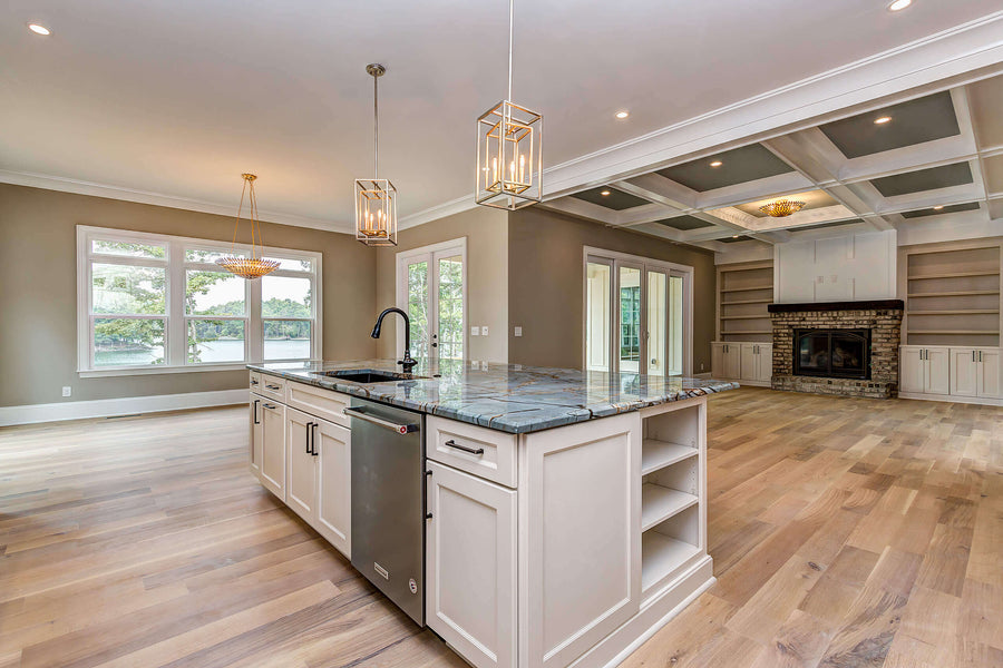 Kitchen island contrasts with beautiful white oak flooring.