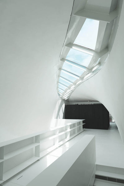 Bright and open living area with natural lighting coming from a skylight.
