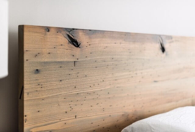 Wormy Chestnut headboard finished with matte wood finishing oil.