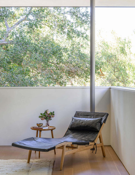 Lounge chair stationed upon hardwood flooring finished with Rubio Monocoat hardwax oil wood finish.