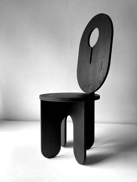 An angled view of a black chair finished with Rubio Monocoat hardwax oil wood finish.