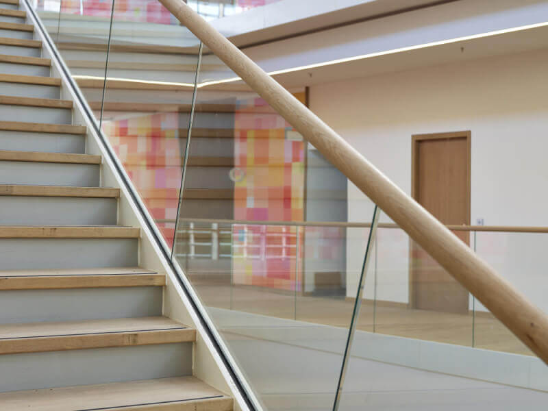 Natural wood stairs and banister.