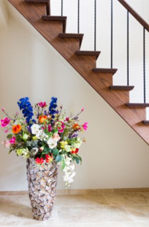 Floors contrast with beautiful walnut stair case finished with Rubio Monocoat.